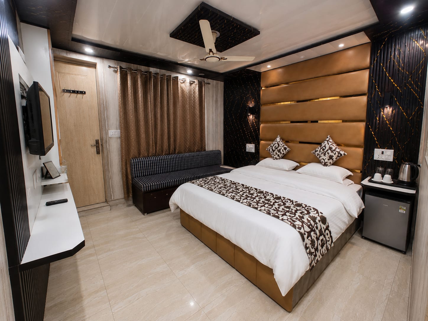 Signature King Suite bedroom at Hotel Luxury Suites Srinagar